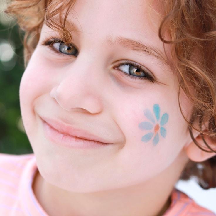 Kaveri Mehta, Lead Design Curator at River Green Stone, reviewing corporate floral arrangements